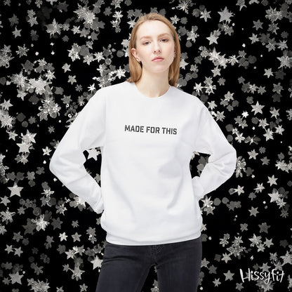 Person wearing a white sweatshirt with 'MADE FOR THIS' text against a star-patterned background