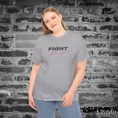 Person wearing a gray t-shirt with 'Fight Like a Girl' text against a textured wall.