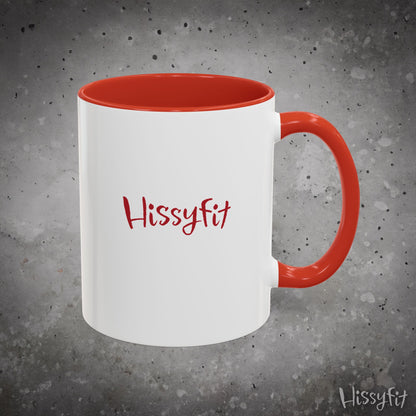 White mug with red interior and handle on a gray background, featuring the word 'Hissyfit'.