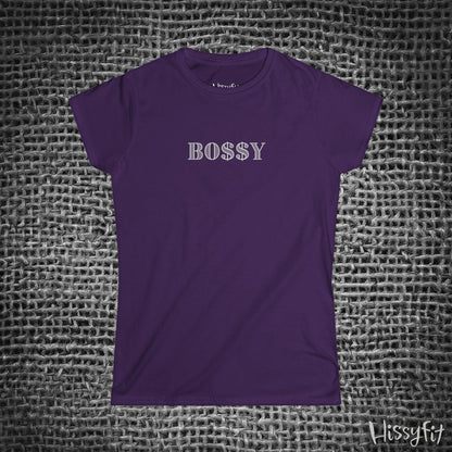Purple t-shirt with 'BOSSY' text on a textured gray background