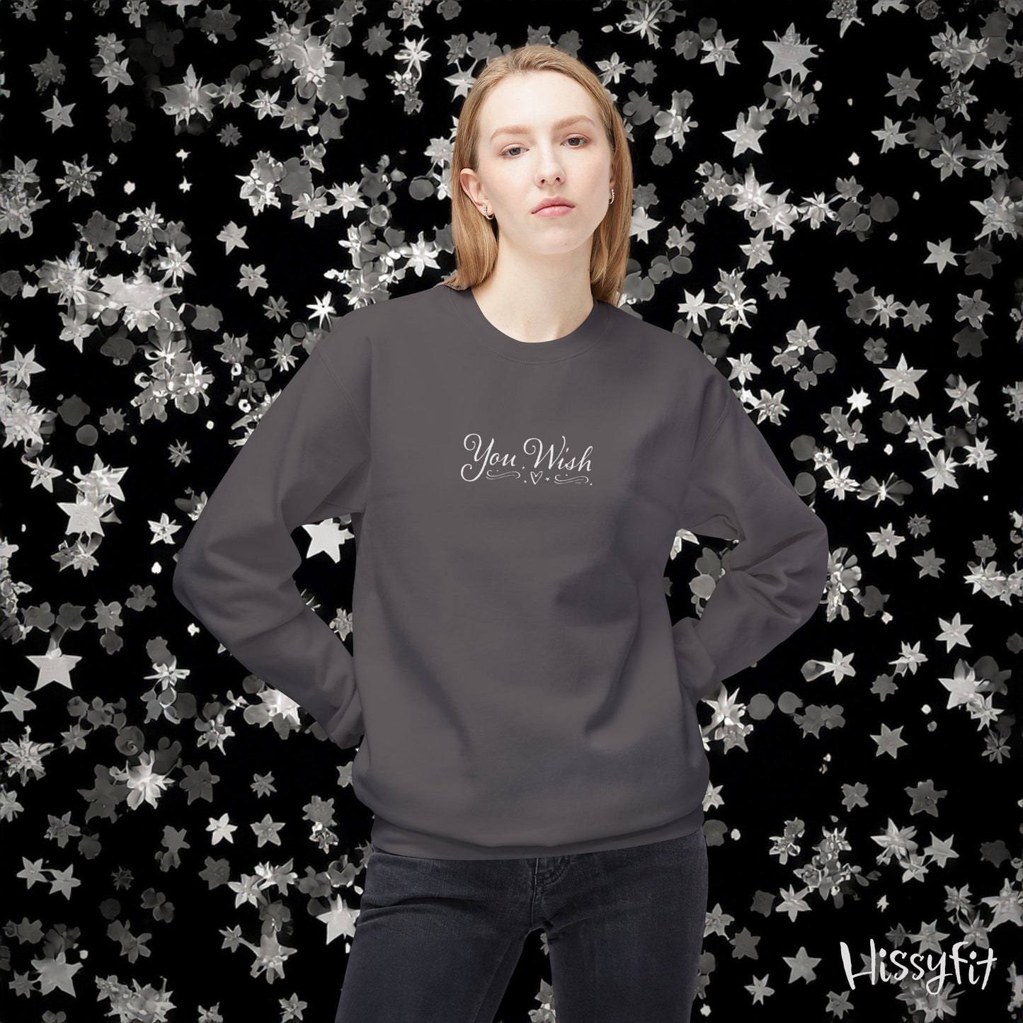 Person wearing a dark gray sweatshirt with 'You Wish' text against a star-patterned background