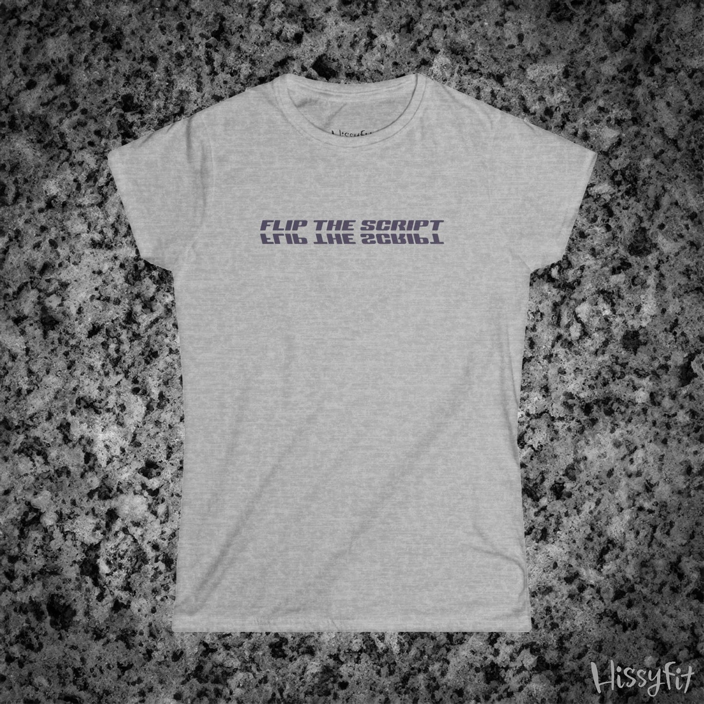 Gray t-shirt with 'FLIP THE SCRIPT' text on a granite surface, featuring the brand 'Hissyfit'.