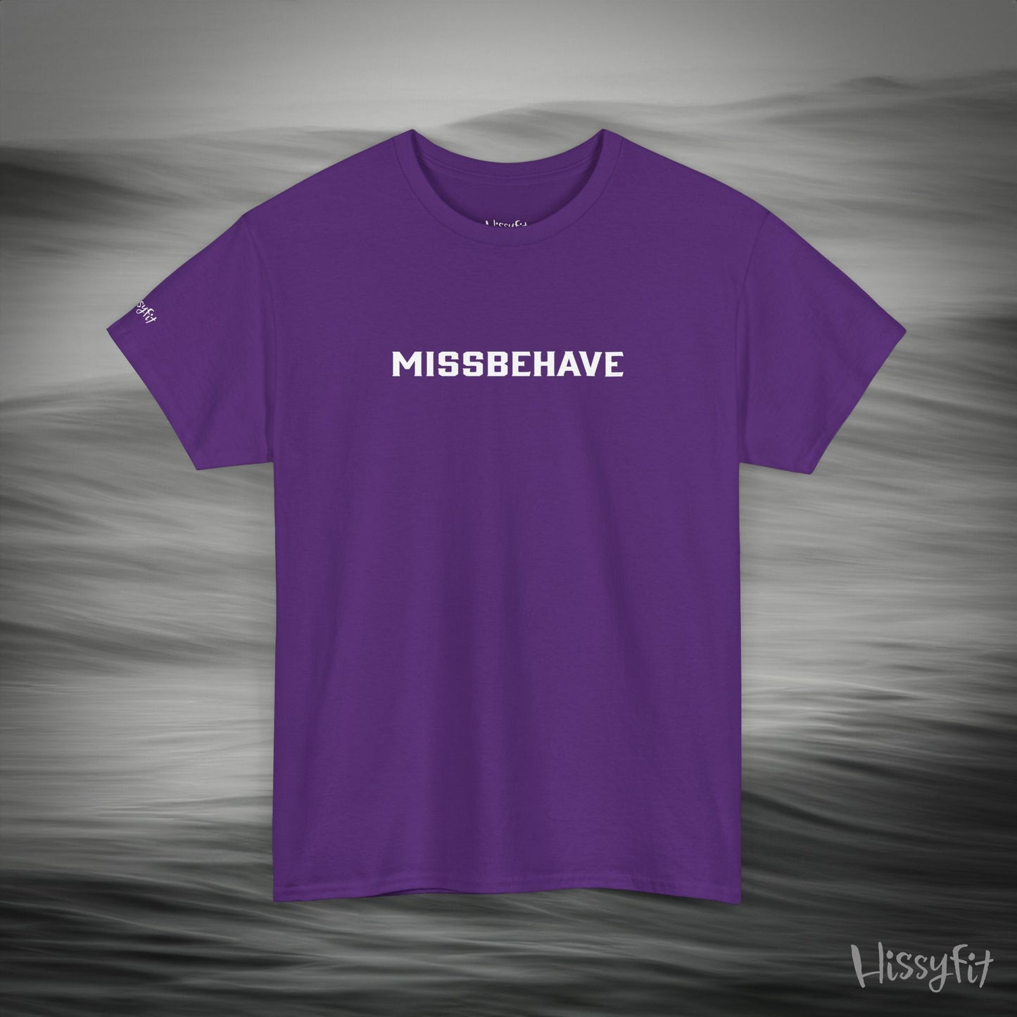 Purple t-shirt with 'MISSBEHAVE' text on a gray background