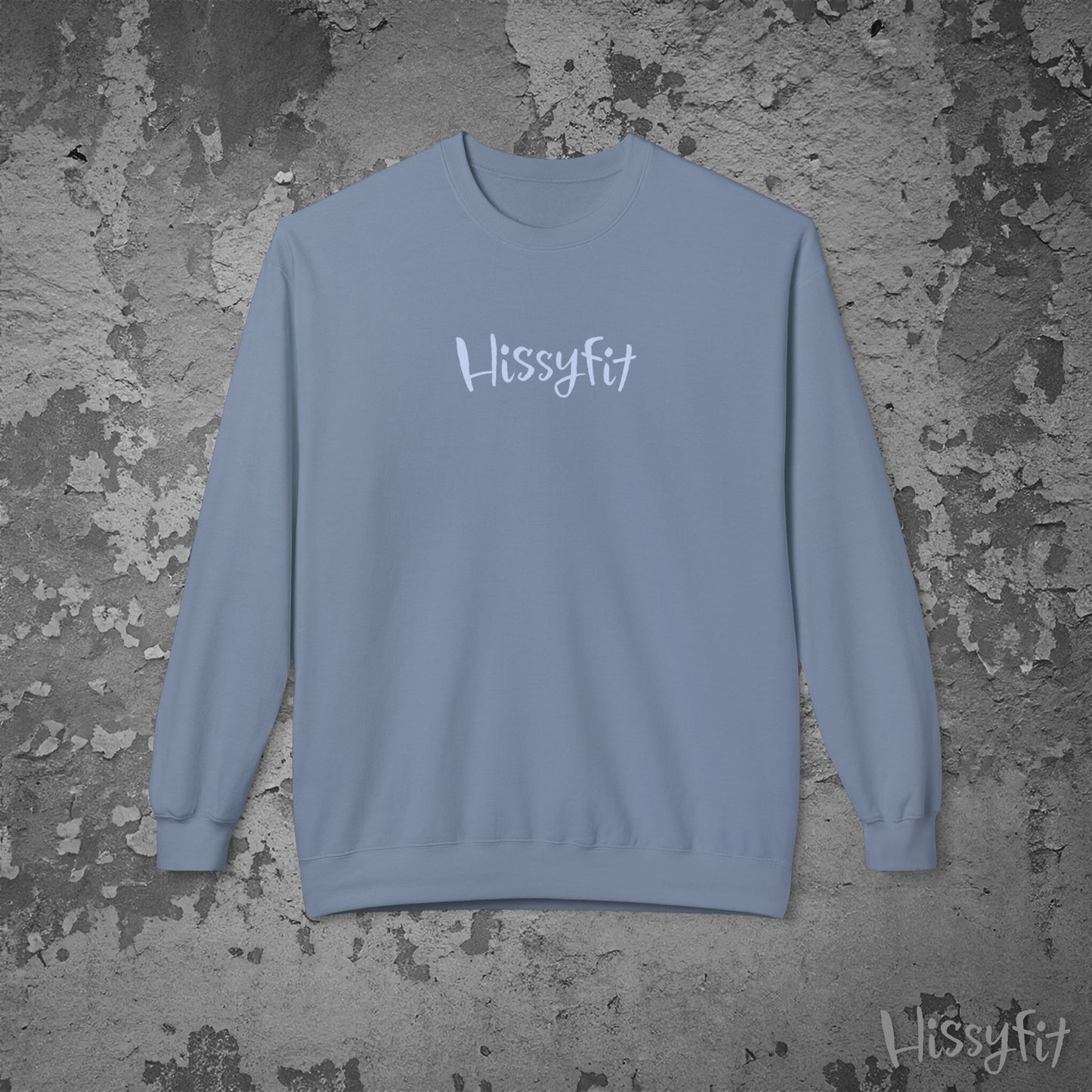 Blue sweatshirt with 'Hissyfit' text on a textured gray background