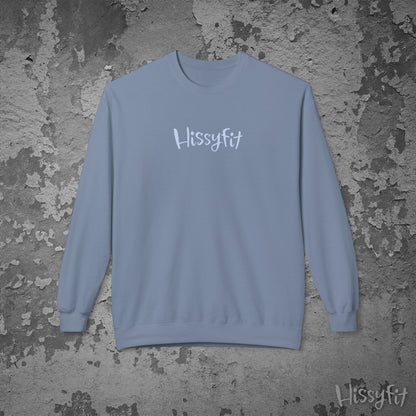 Blue sweatshirt with 'Hissyfit' text on a textured gray background