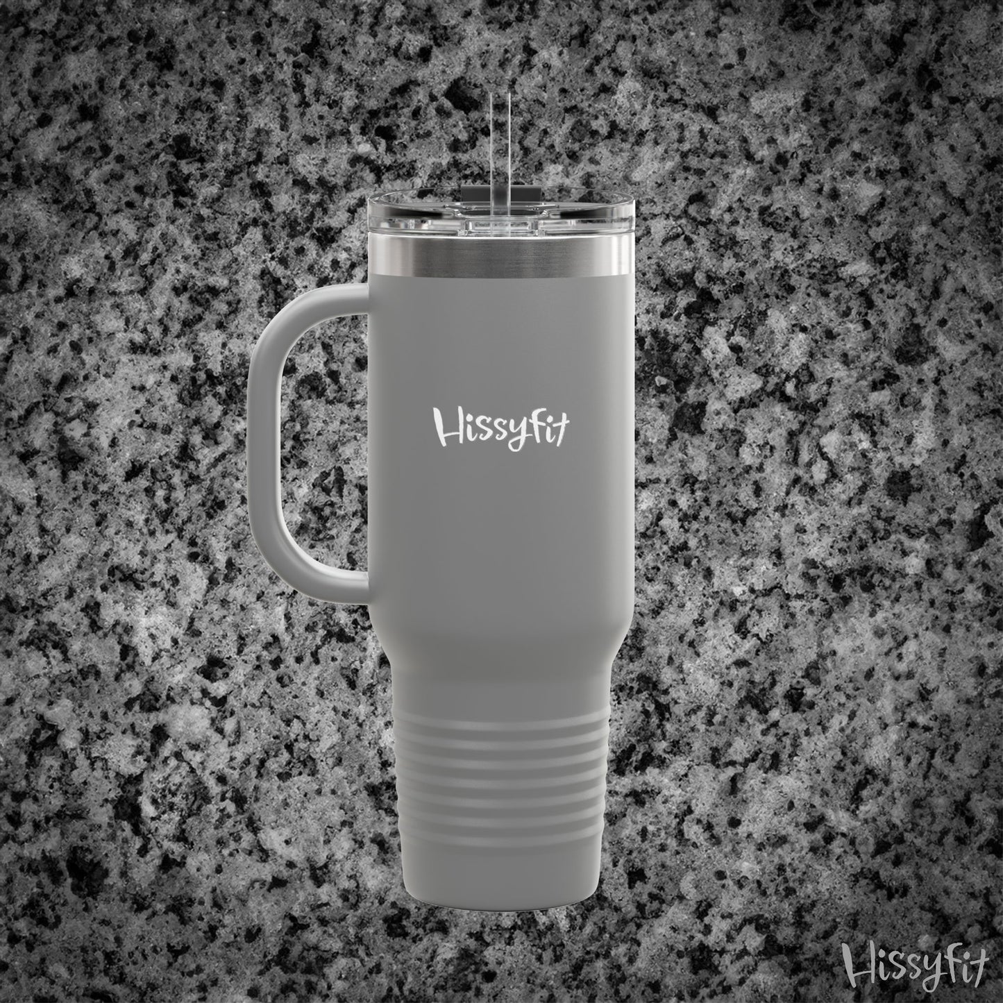 Gray travel mug with handle on a granite surface, featuring 'Hissyfit' branding.
