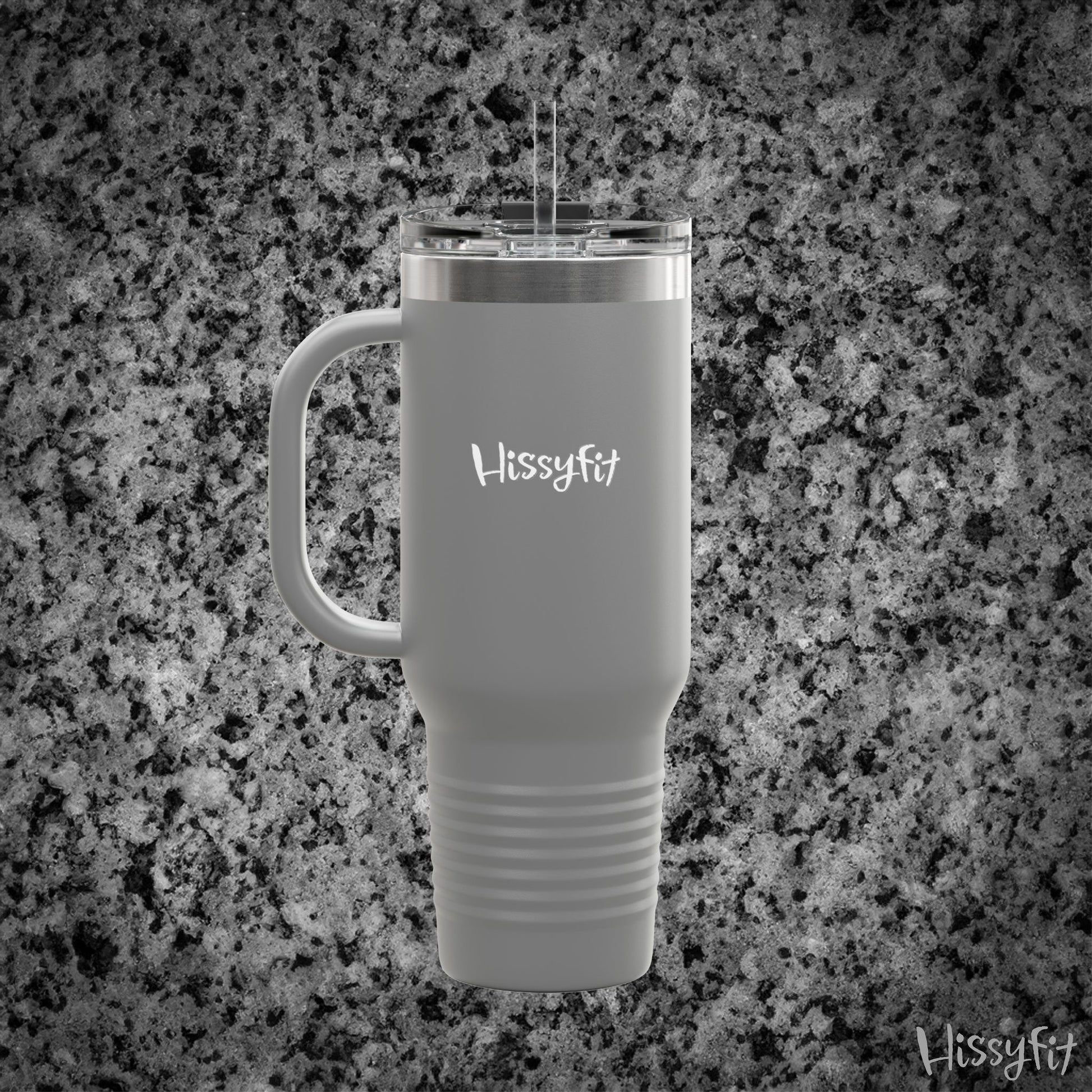 Gray travel mug with handle on a granite surface, featuring 'Hissyfit' branding.