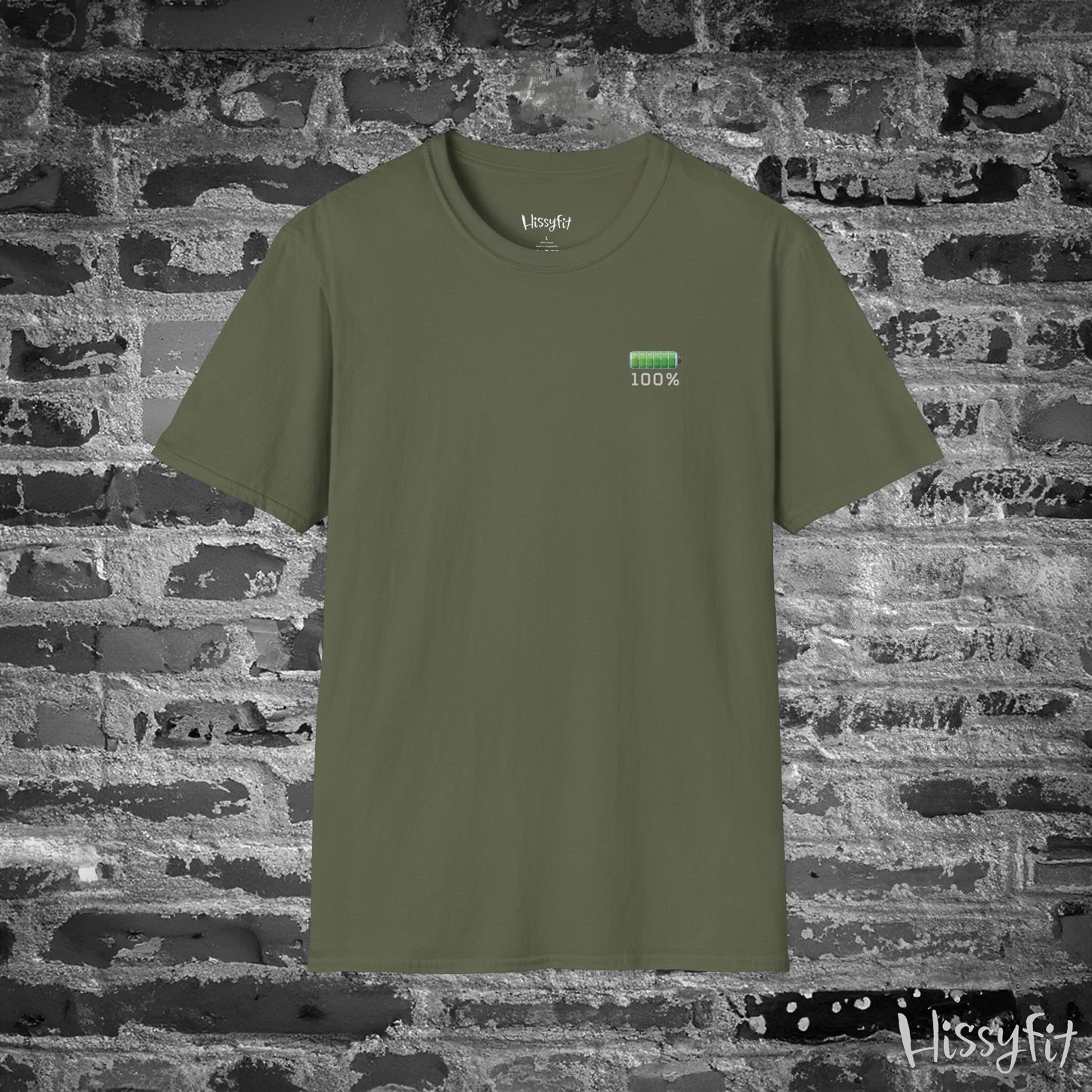 Green t-shirt with a green battery symbol displaying '100 percent charged' on a brick wall background