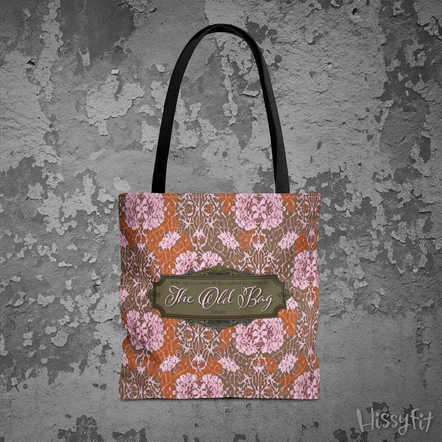 Floral patterned tote bag with 'The Old Bag' label on a textured gray background