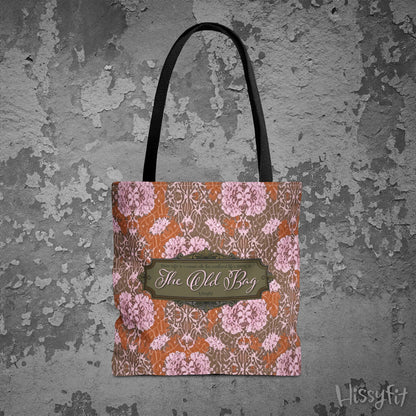 Floral patterned tote bag with 'The Old Bag' label on a textured gray background