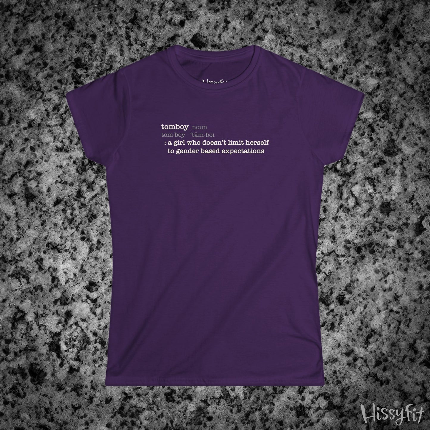 Purple t-shirt with text 'Tomboy:definition' on a gray granite surface, featuring the brand 'Hissyfit'.