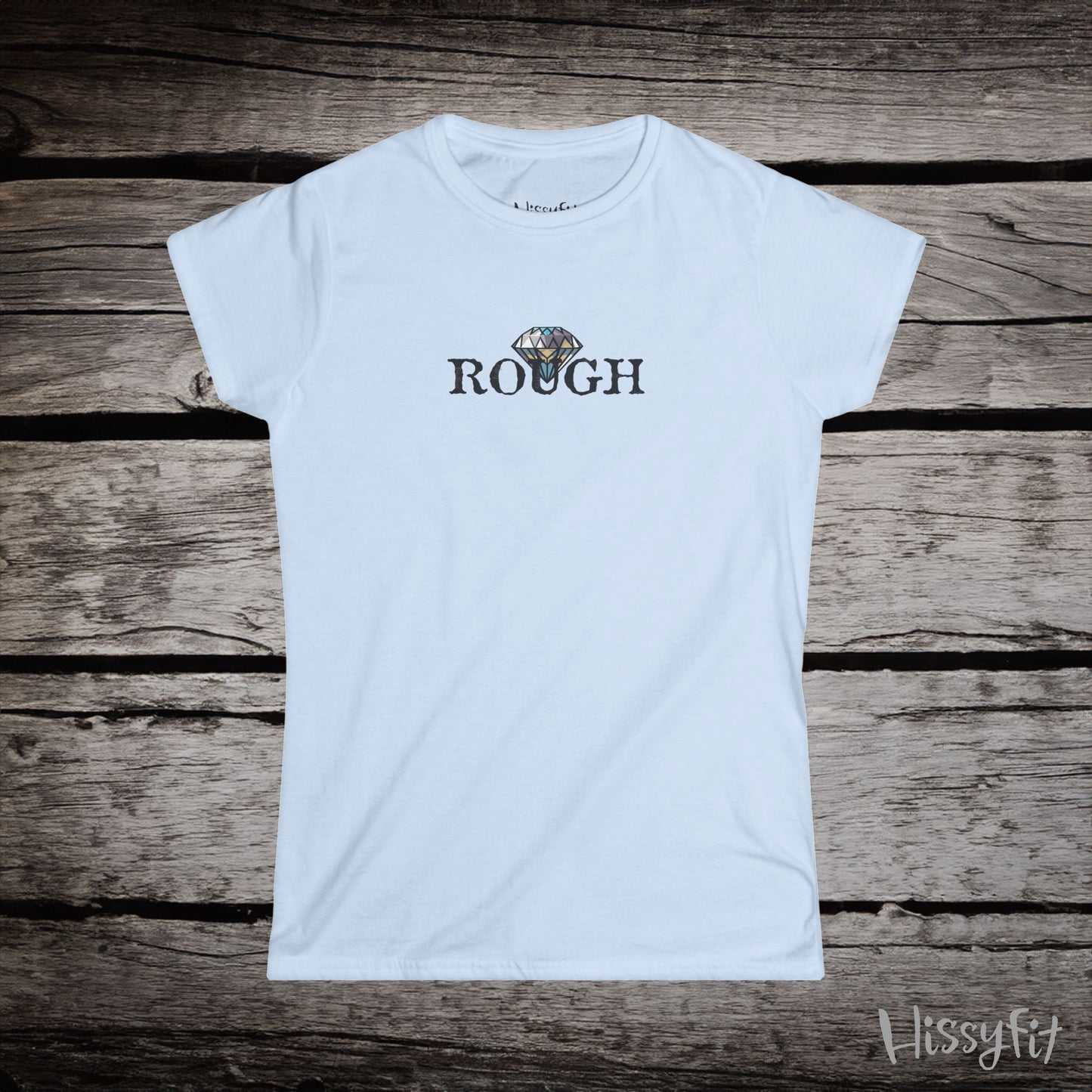 White t-shirt with a graphic diamond in 'Rough' text on a wooden surface, featuring the brand 'Hissyfit'.