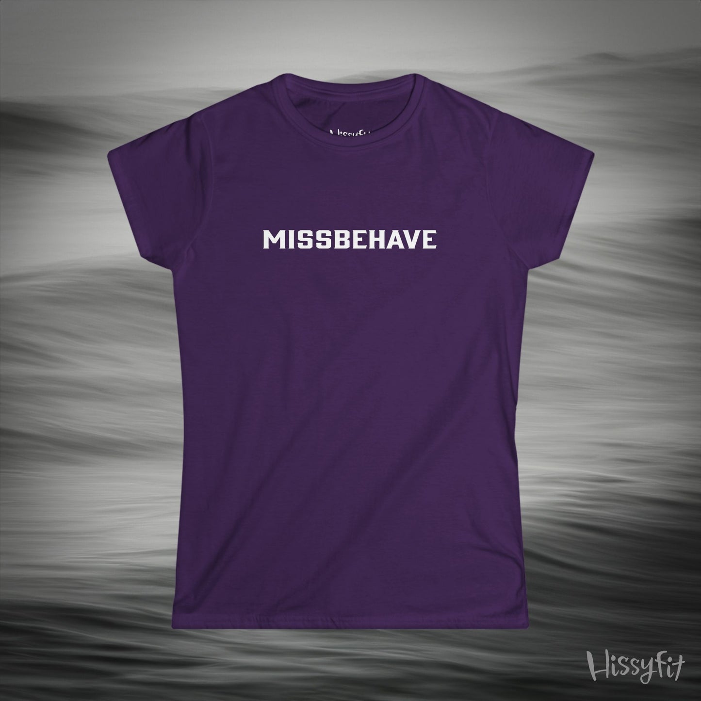 Purple t-shirt with 'MISSBEHAVE' text on a gray background