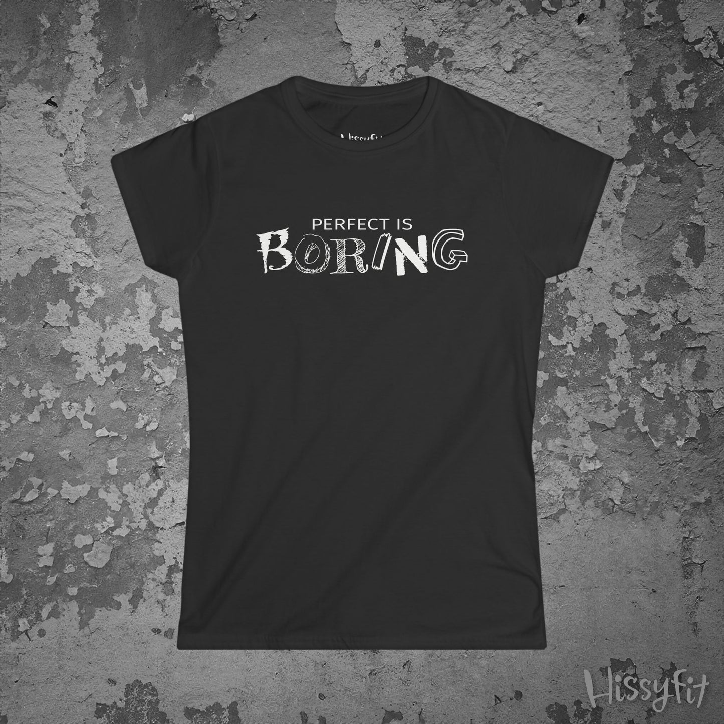 Black t-shirt with 'PERFECT IS BORING' text on a textured gray background