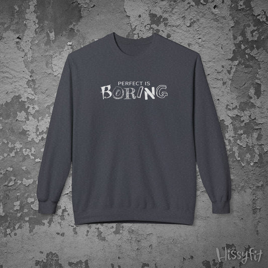 Gray sweatshirt with 'Perfect is Boring' text on a textured gray background