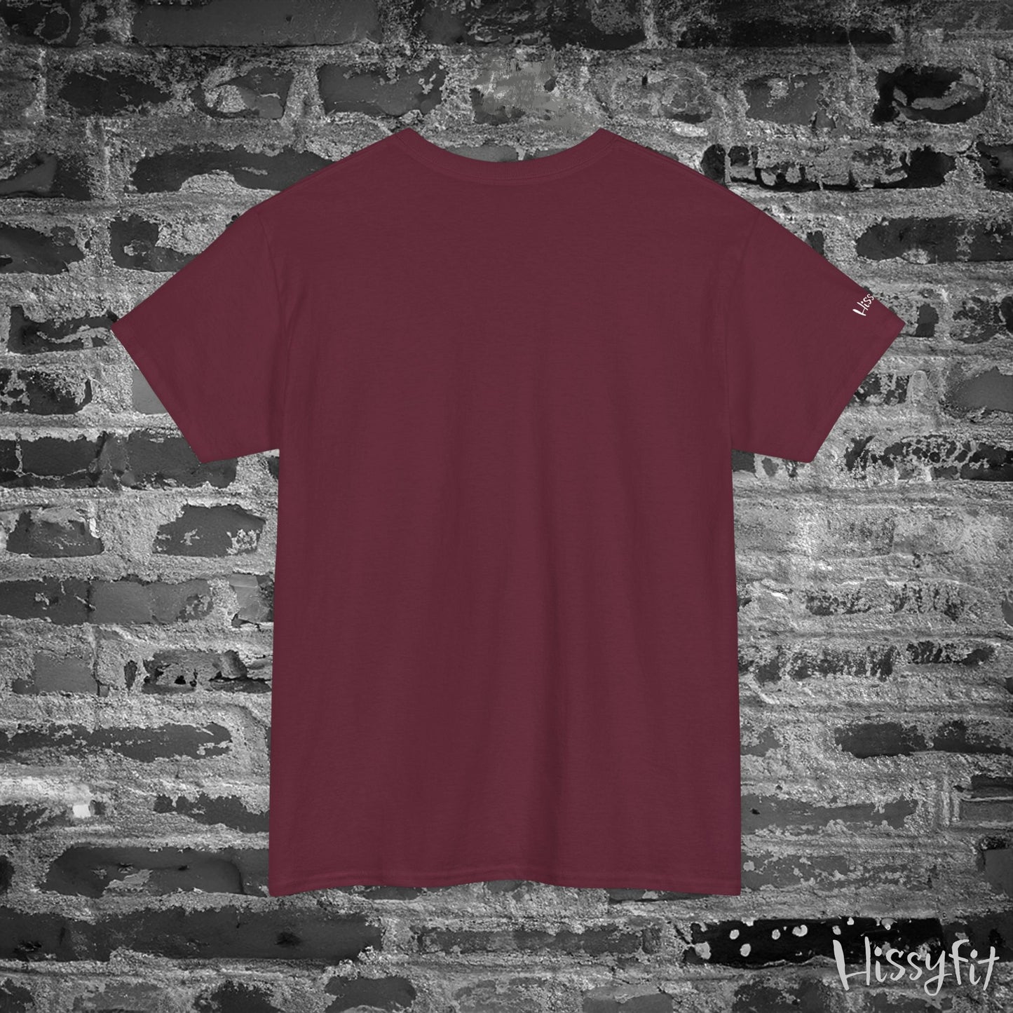 Maroon t-shirt on a textured stone wall background