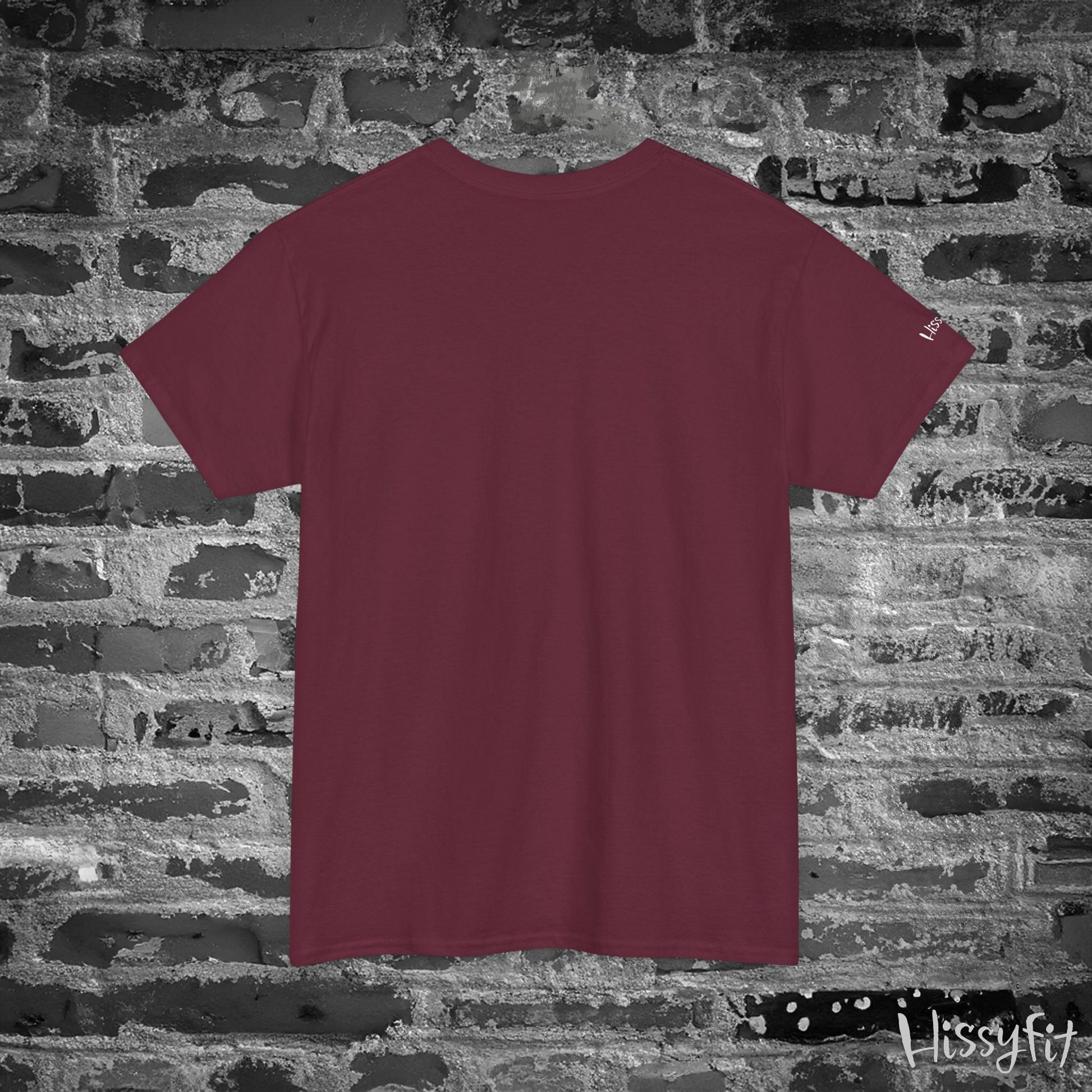 Maroon t-shirt on a textured stone wall background